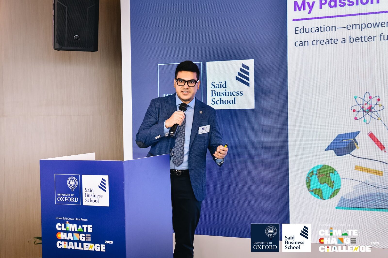 CS teacher Sushil Lamba presenting at Oxford Saïd Climate Change Challenge podium on education and sustainability